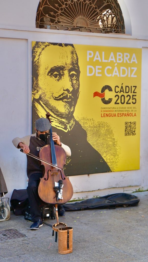 A busker in front of the city’s food market, accompanied by a hip-hop track